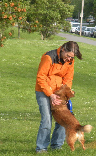 Carolyn Fancher, DC playing with her dog outdoors
